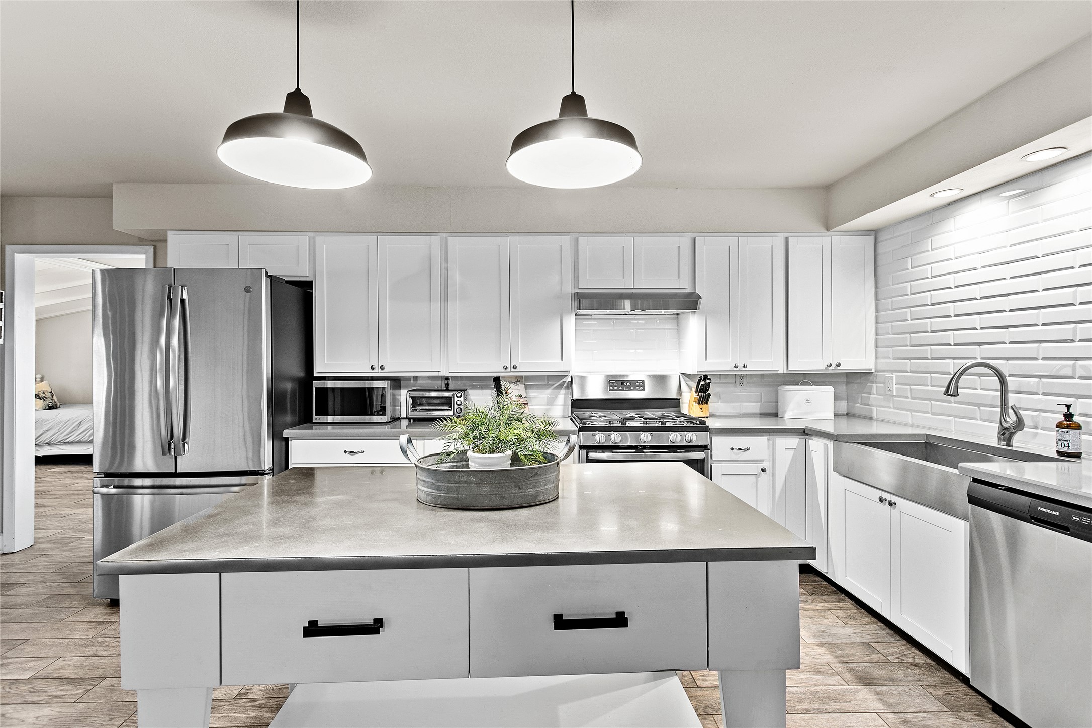 200 Creek Road Dripping Springs, TX 78620 - Photo 6 of 40 a kitchen with appliances a sink and cabinets