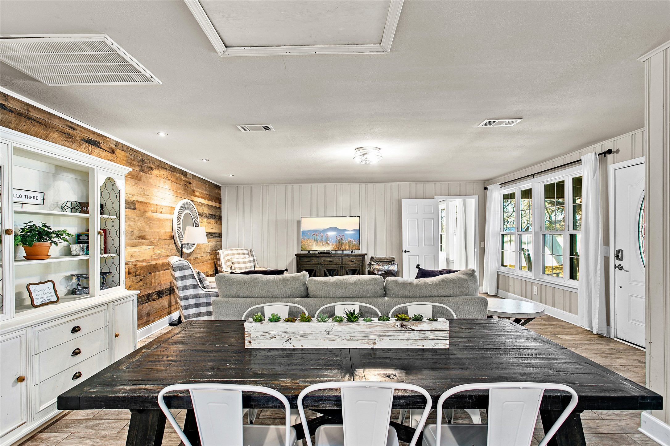 200 Creek Road Dripping Springs, TX 78620 - Photo 8 of 40 a kitchen with kitchen island granite countertop a stove and white cabinets
