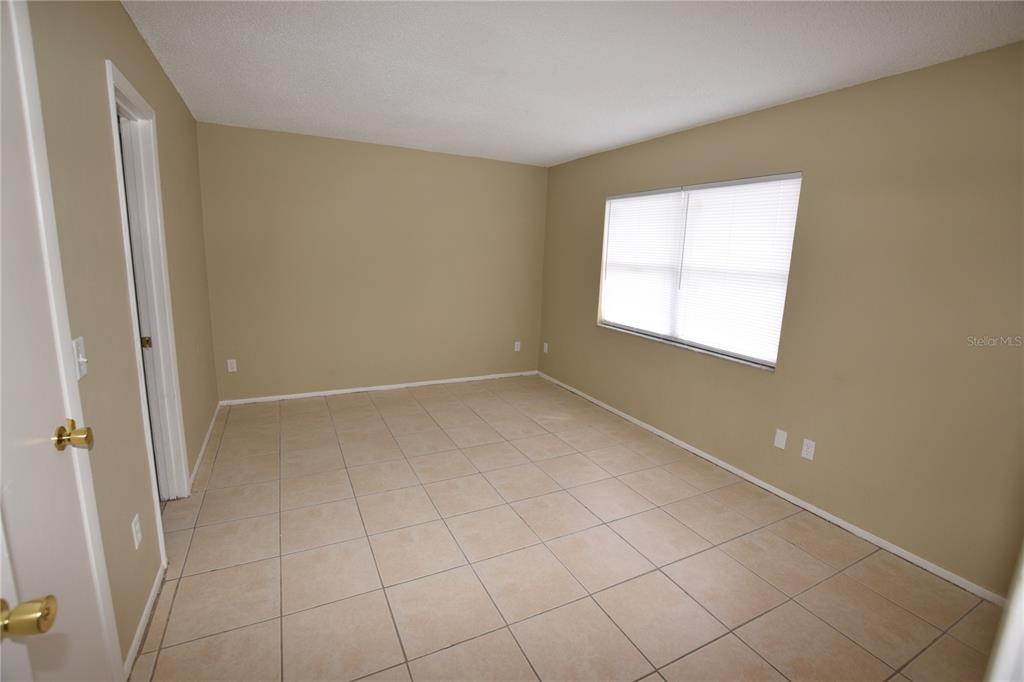 3173 Split Willow Drive Orlando, FL 32808 - Photo 12 of 16 a view of an empty room with a window