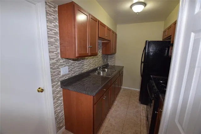 a bathroom with a sink a mirror and a shower