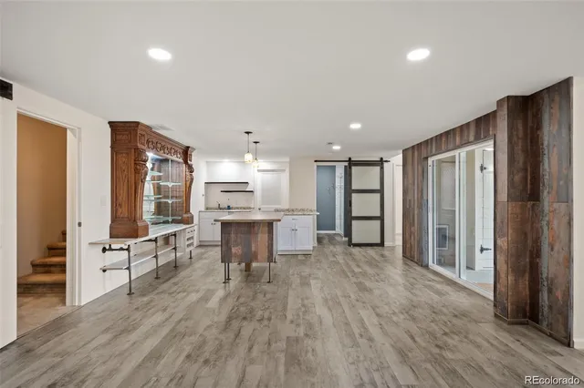 a view of kitchen with furniture and wooden floor