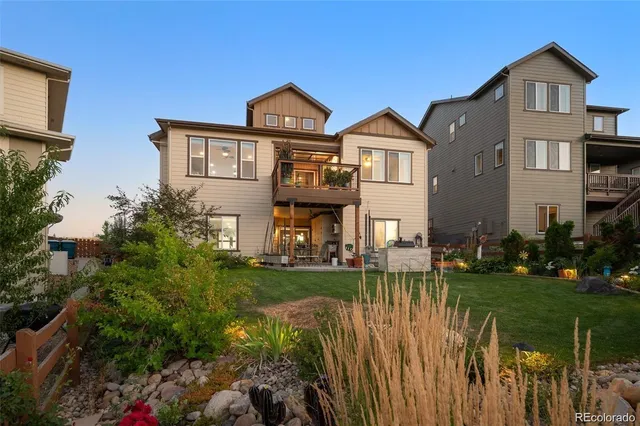a front view of a house with a yard table and chairs