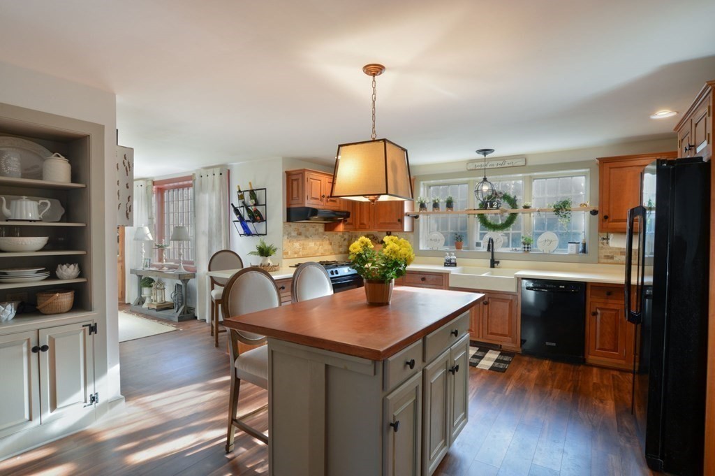 3 Academy Road Sandwich, MA 02563 - Photo 11 of 41 a kitchen with a table chairs refrigerator and cabinets