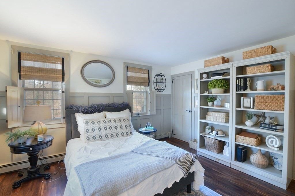 3 Academy Road Sandwich, MA 02563 - Photo 16 of 41 a bedroom with a bed and wooden floor