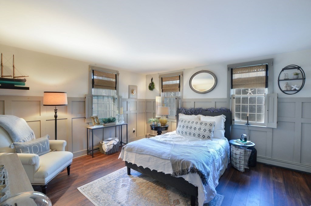 3 Academy Road Sandwich, MA 02563 - Photo 17 of 41 a bedroom with a bed and wooden floor