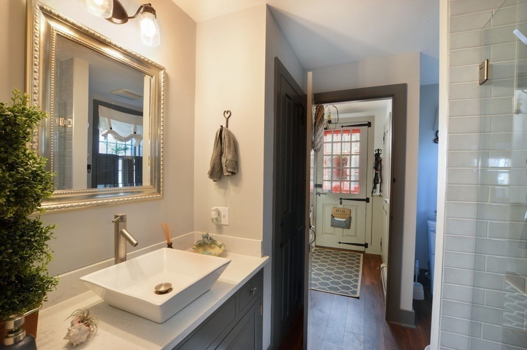 3 Academy Road Sandwich, MA 02563 - Photo 18 of 41 a bathroom with a sink and a mirror