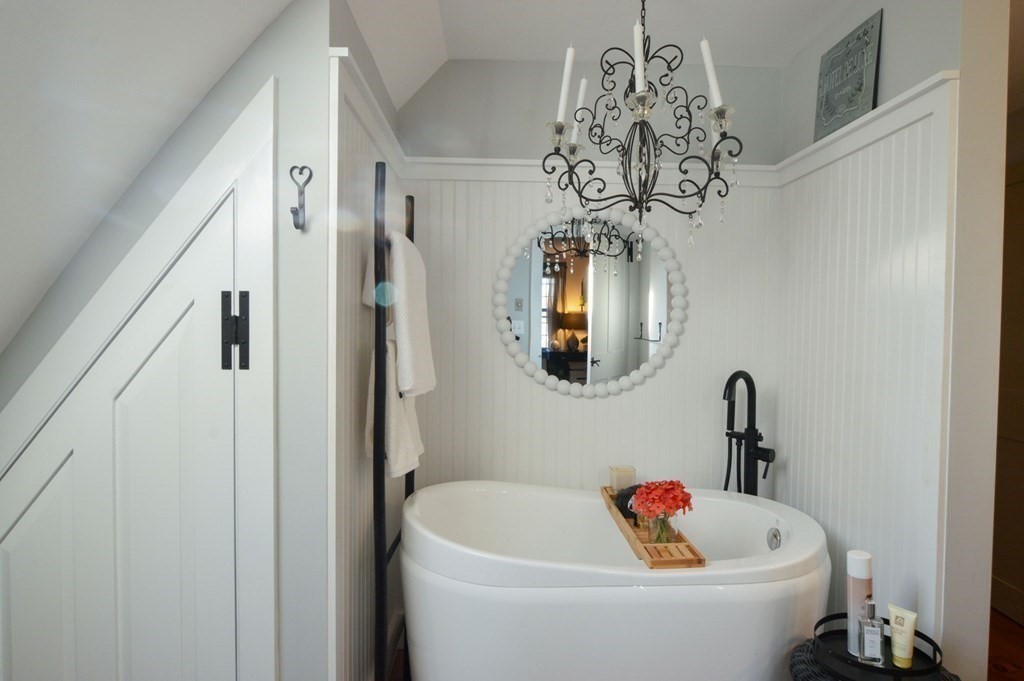 3 Academy Road Sandwich, MA 02563 - Photo 24 of 41 a white bath tub sitting next to a white door