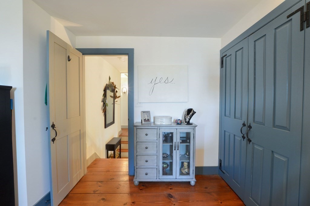 3 Academy Road Sandwich, MA 02563 - Photo 26 of 41 a view of a hallway with windows and cabinet