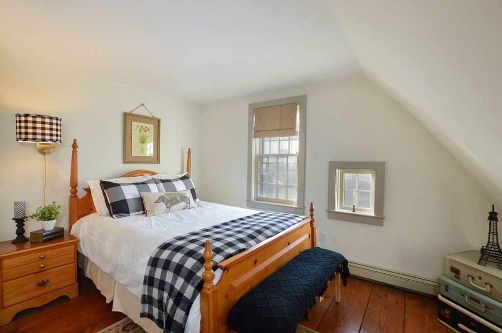 3 Academy Road Sandwich, MA 02563 - Photo 28 of 41 a bedroom with a bed and wooden floor