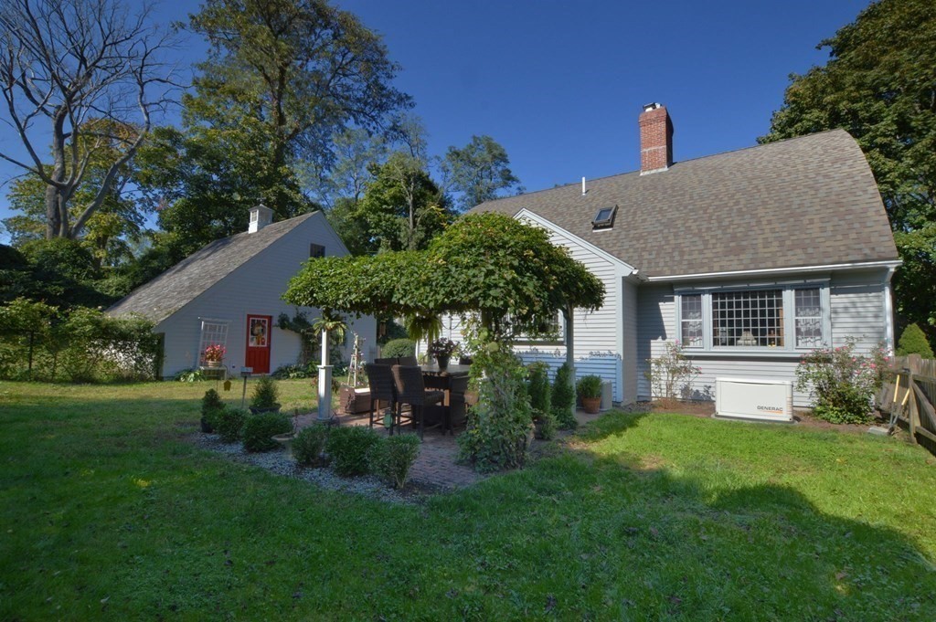 3 Academy Road Sandwich, MA 02563 - Photo 3 of 41 a front view of a house with a garden and plants