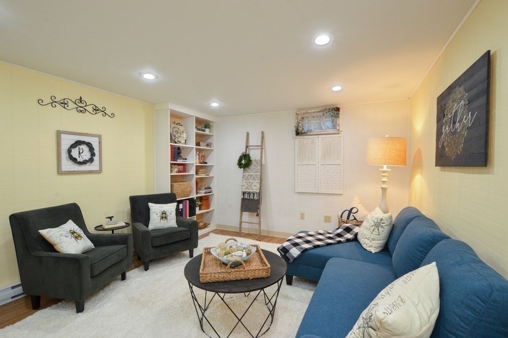 3 Academy Road Sandwich, MA 02563 - Photo 32 of 41 a living room with furniture and a wooden floor