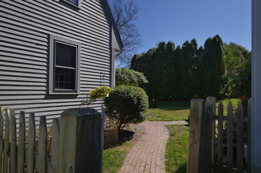 3 Academy Road Sandwich, MA 02563 - Photo 36 of 41 a backyard of a house with lots of green space