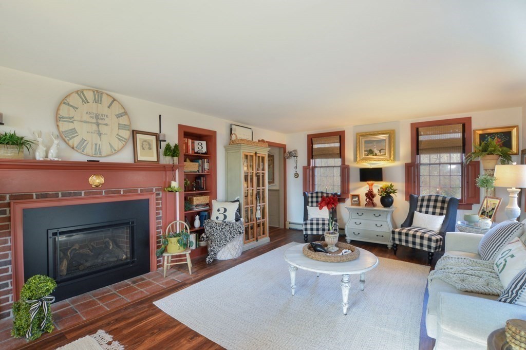 3 Academy Road Sandwich, MA 02563 - Photo 6 of 41 a living room with furniture and a fireplace