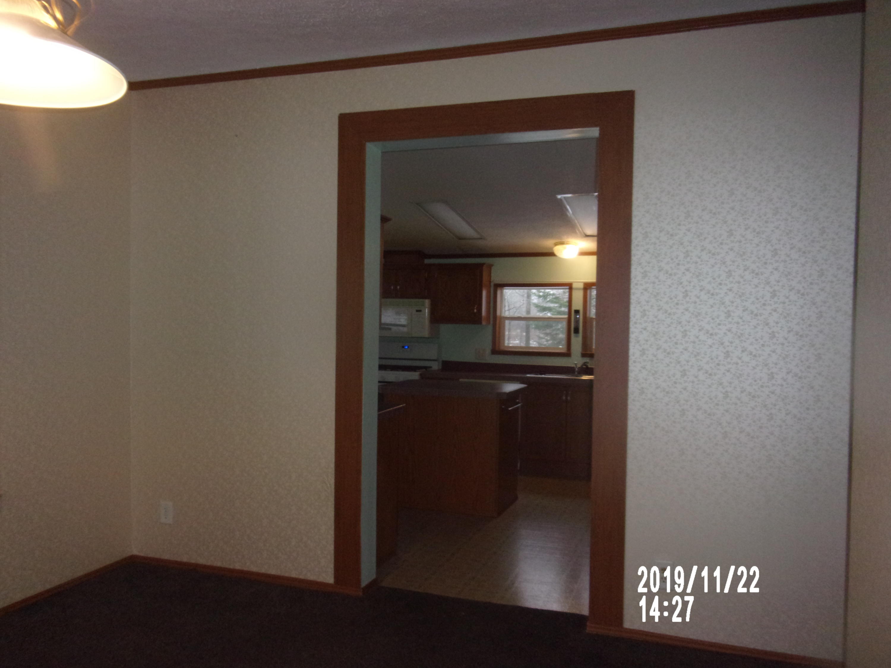 74 Guilford Center Road Guilford, ME 04443 - Photo 22 of 32 dining room to kitchen