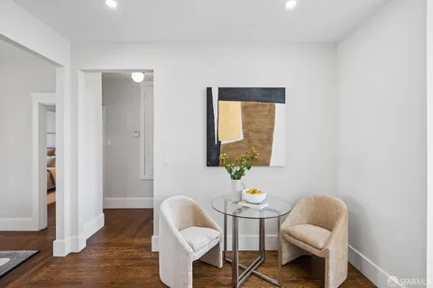 a bedroom with bed and a potted plant