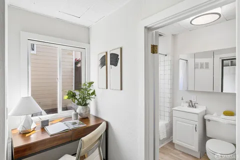 a view of a patio with couches table and chairs and potted plants