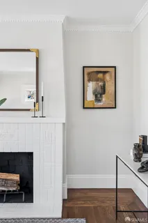 a living room with furniture a rug and a fireplace