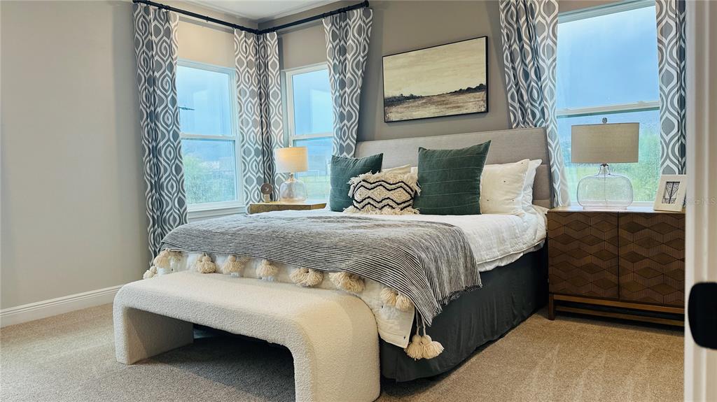 16450 Hamlin View Street Winter Garden, FL 34787 - Photo 16 of 32 a bedroom with a bed and window