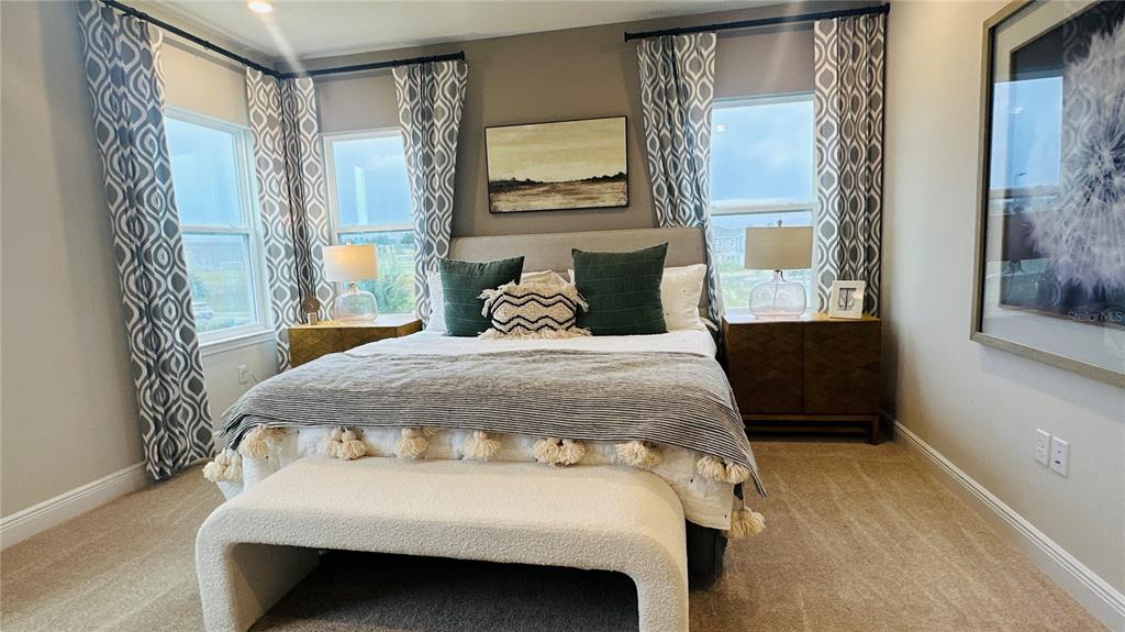 16450 Hamlin View Street Winter Garden, FL 34787 - Photo 17 of 32 a bedroom with a bed and window