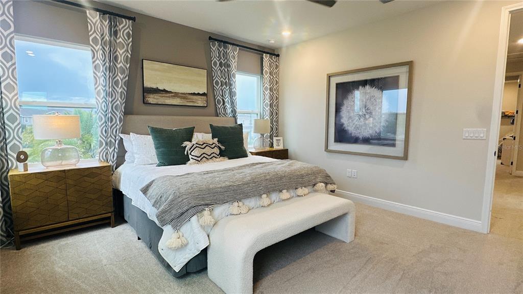 16450 Hamlin View Street Winter Garden, FL 34787 - Photo 19 of 32 a bedroom with a bed and window