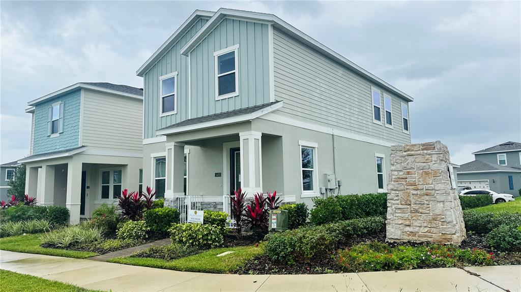 16450 Hamlin View Street Winter Garden, FL 34787 - Photo 2 of 32 a front view of a house with a yard