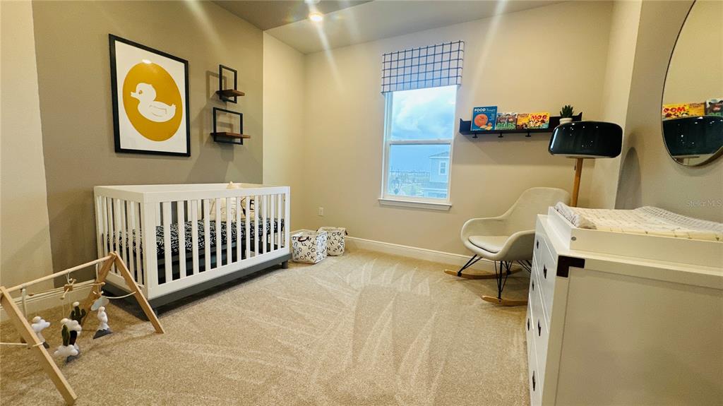 16450 Hamlin View Street Winter Garden, FL 34787 - Photo 25 of 32 a view of livingroom with furniture and windows
