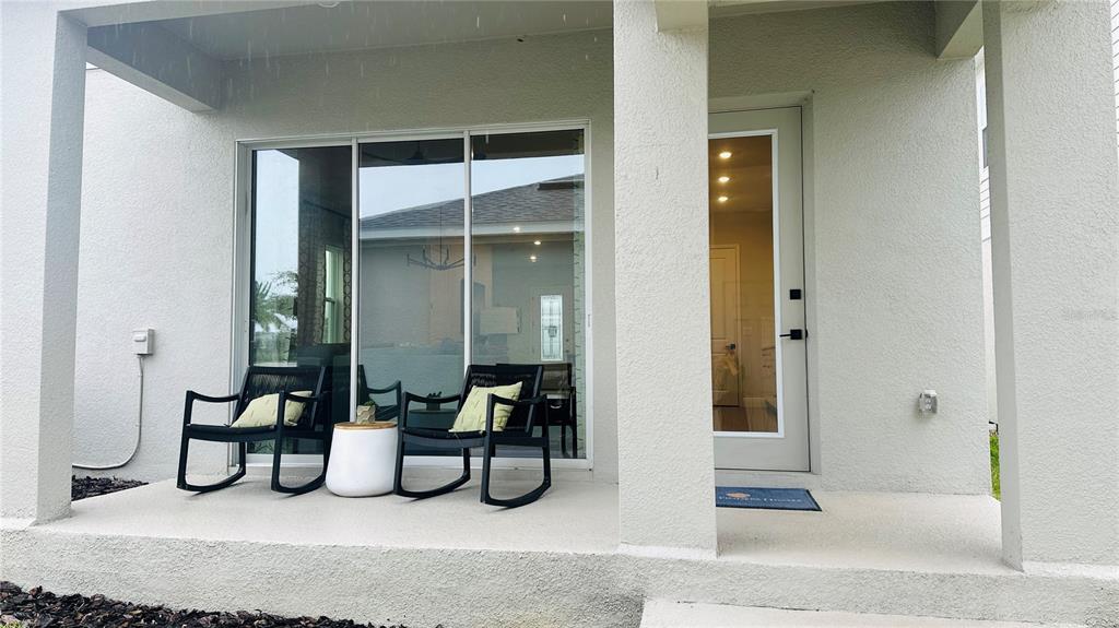 16450 Hamlin View Street Winter Garden, FL 34787 - Photo 31 of 32 a bedroom with furniture and a potted plant