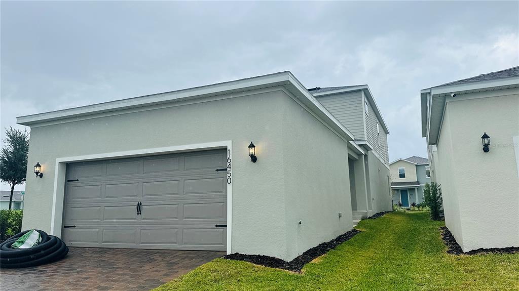 16450 Hamlin View Street Winter Garden, FL 34787 - Photo 32 of 32 a view of a house with garage