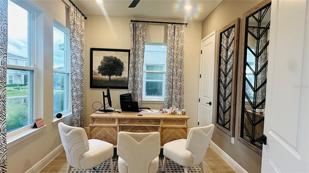 16450 Hamlin View Street Winter Garden, FL 34787 - Photo 5 of 32 a living room with furniture and a flat screen tv