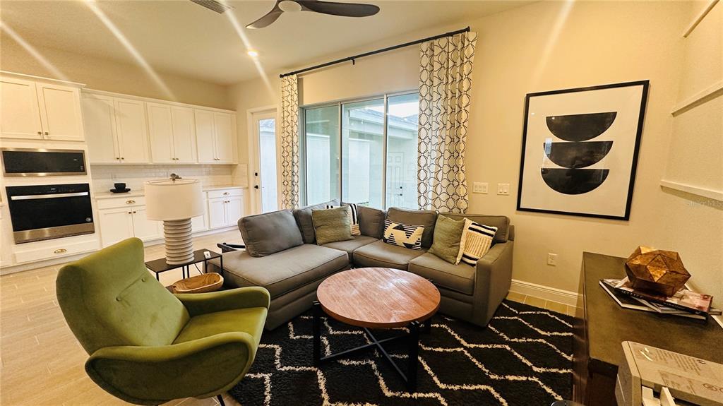 16450 Hamlin View Street Winter Garden, FL 34787 - Photo 7 of 32 a living room with furniture and a window