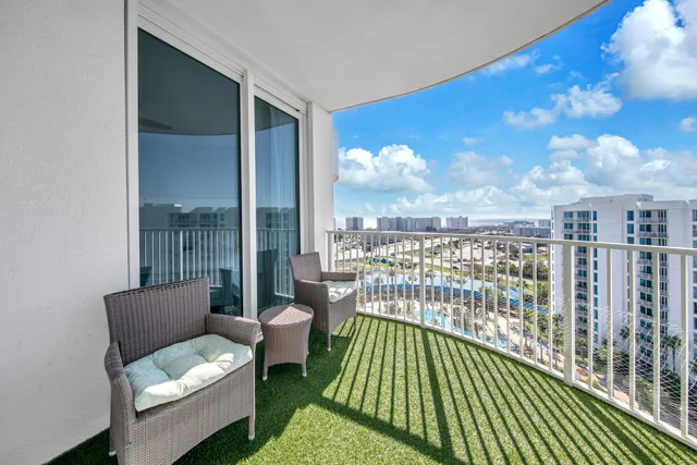 a view of a balcony with furniture