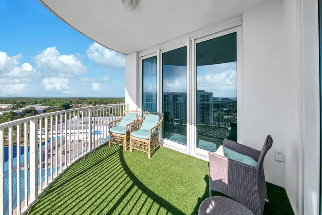 a view of a chair and table in the balcony