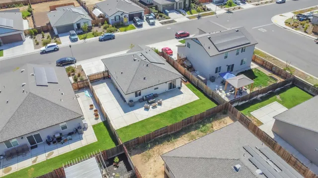 an aerial view of a house with a garden