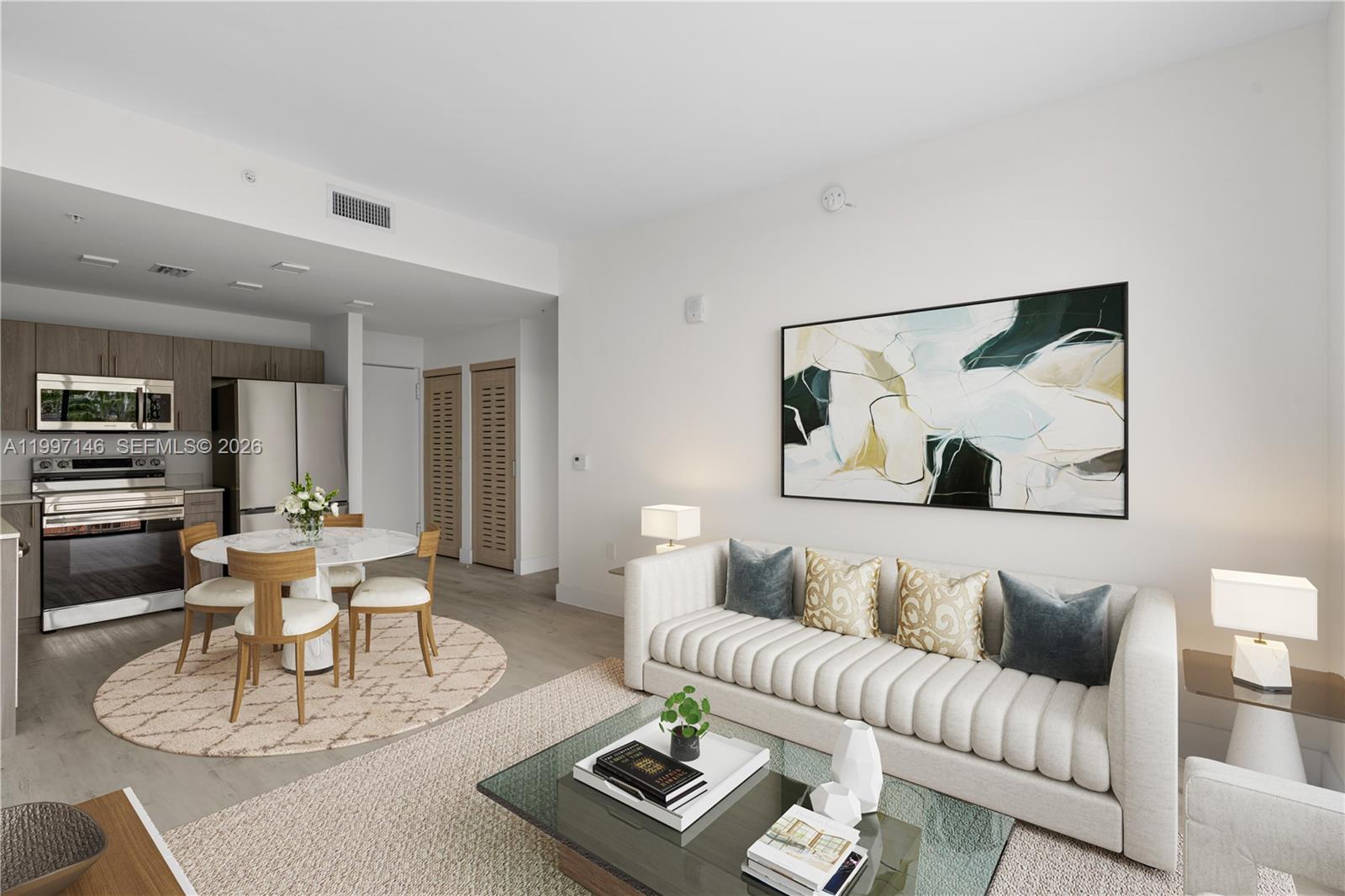 1601 Southwest 32nd Avenue, Unit 403 Miami, FL 33145 - Photo 1 of 4 a living room with furniture and wooden floor