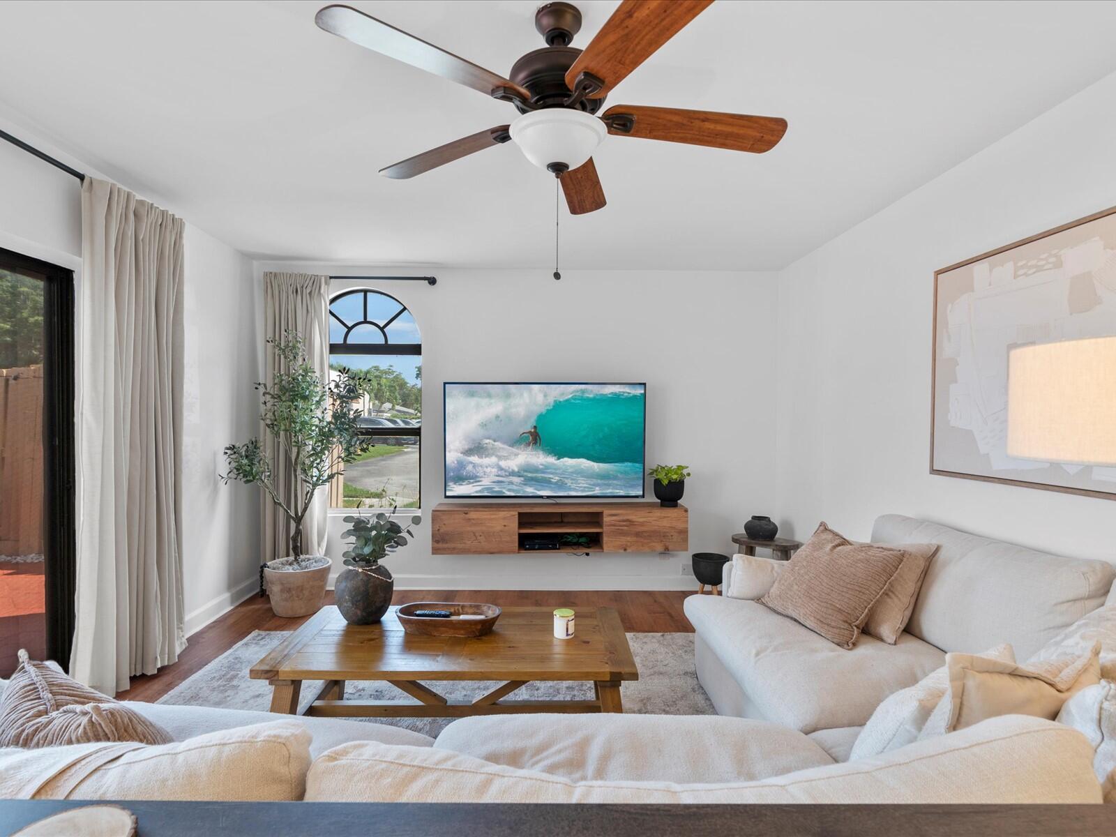 a living room with furniture and a flat screen tv