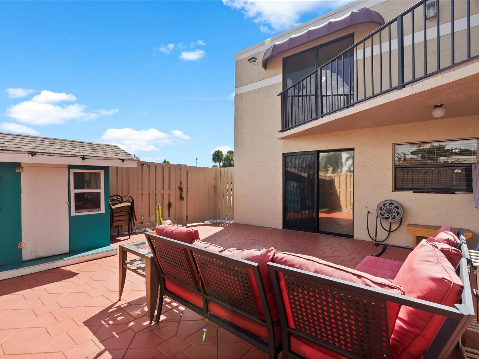 4025 Village Drive, Unit C Delray Beach, FL 33445 - Photo 11 of 32 a outdoor space with furniture