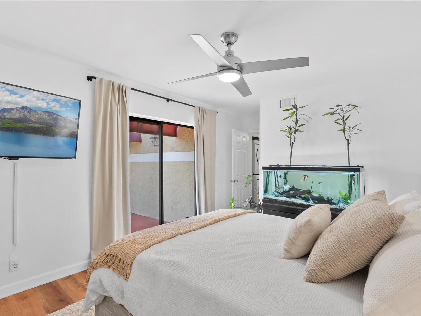 4025 Village Drive, Unit C Delray Beach, FL 33445 - Photo 15 of 32 a bedroom with a bed and window