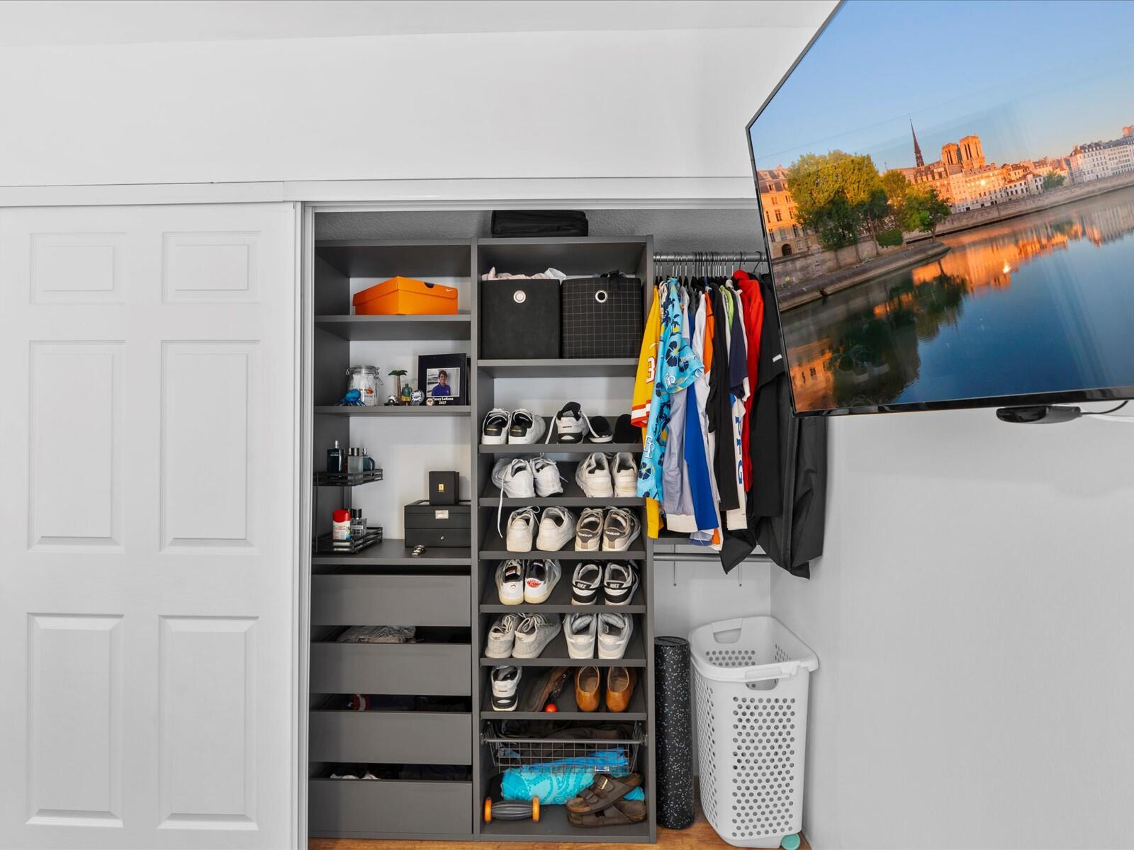 4025 Village Drive, Unit C Delray Beach, FL 33445 - Photo 16 of 32 a view of walk in closet with clothes and shoes