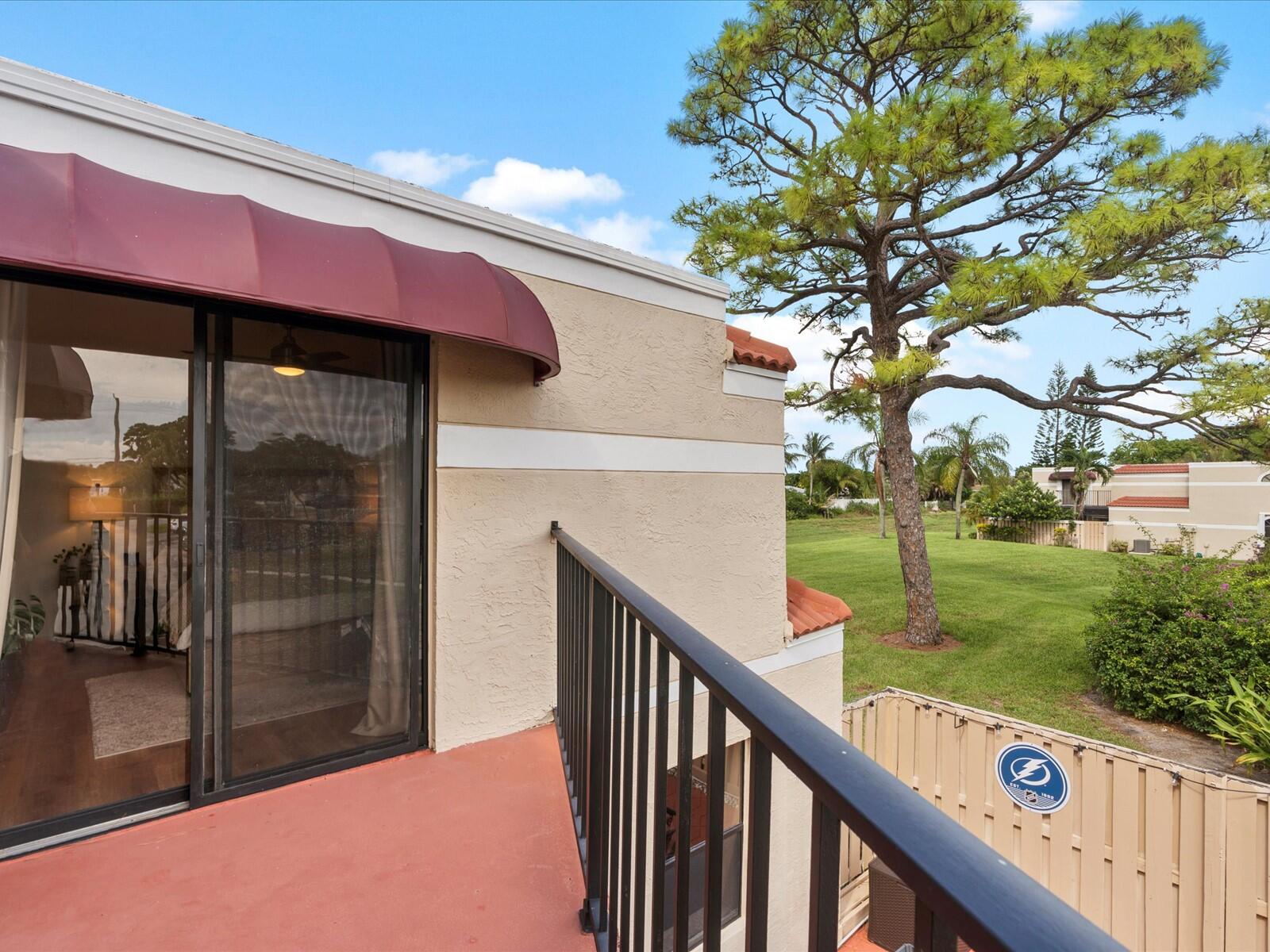 4025 Village Drive, Unit C Delray Beach, FL 33445 - Photo 22 of 32 a balcony view with an outdoor space