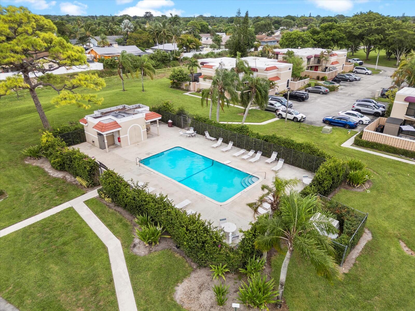 4025 Village Drive, Unit C Delray Beach, FL 33445 - Photo 31 of 32 an aerial view of a house with a garden