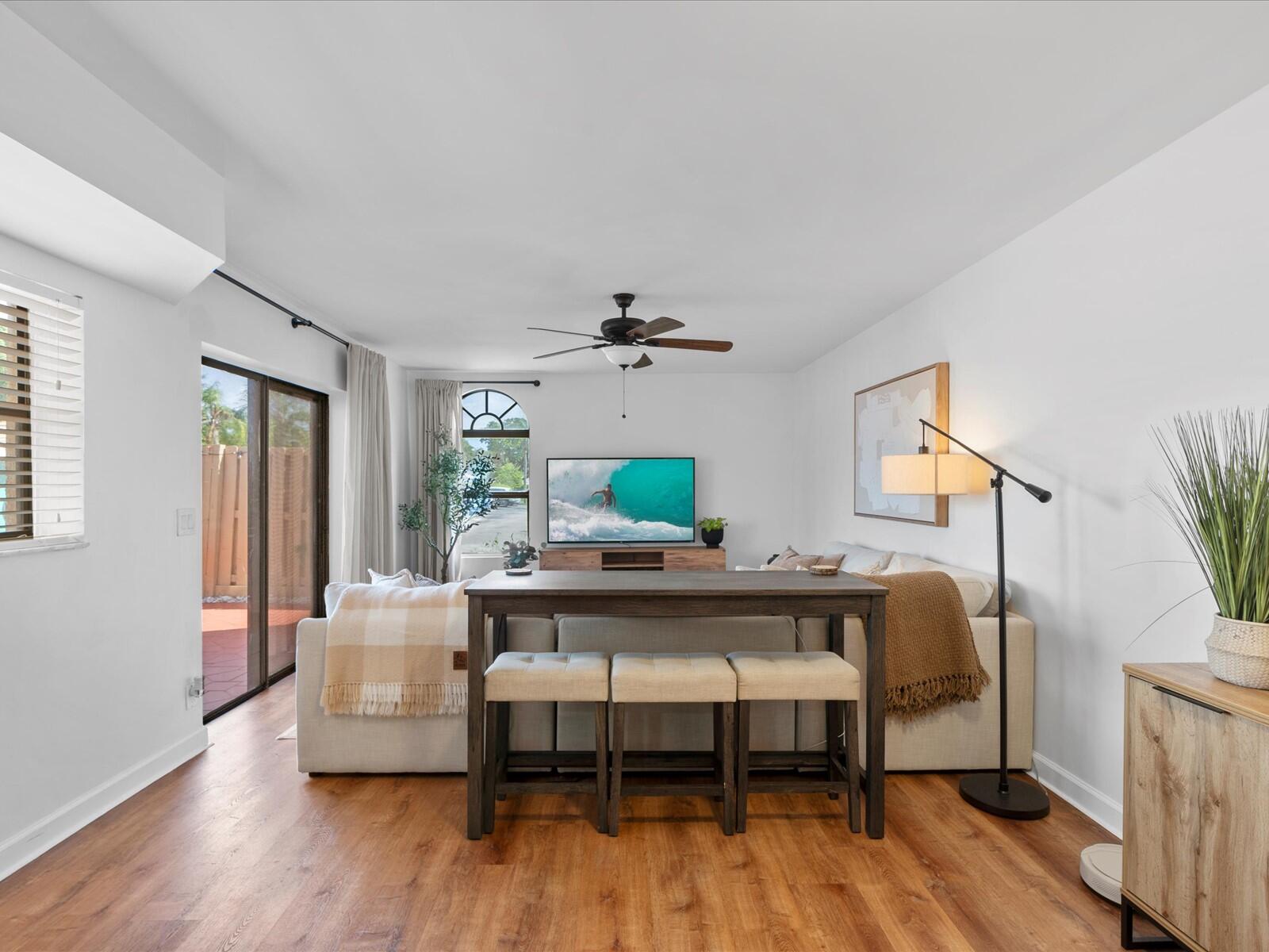 4025 Village Drive, Unit C Delray Beach, FL 33445 - Photo 4 of 32 a living room with furniture and a wooden floor