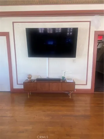 a living room with a flat screen tv and a couch