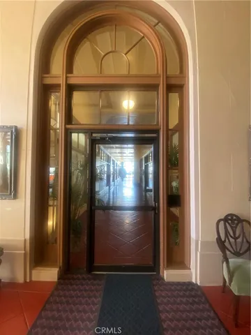 a view of empty room with wooden door