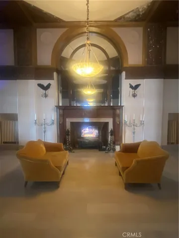 a lobby with furniture and a potted plant