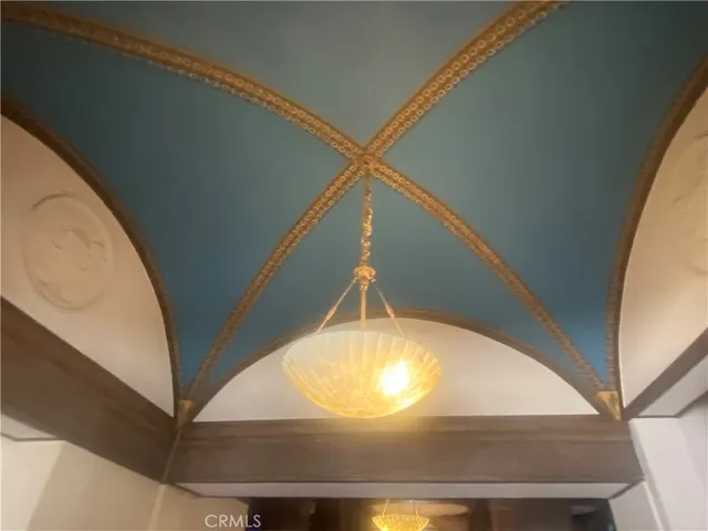 a view of a livingroom with furniture and a chandelier