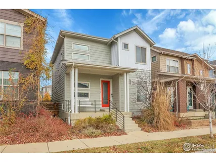 a view of a brick house with large windows