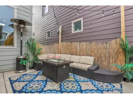 a view of a backyard with sitting area