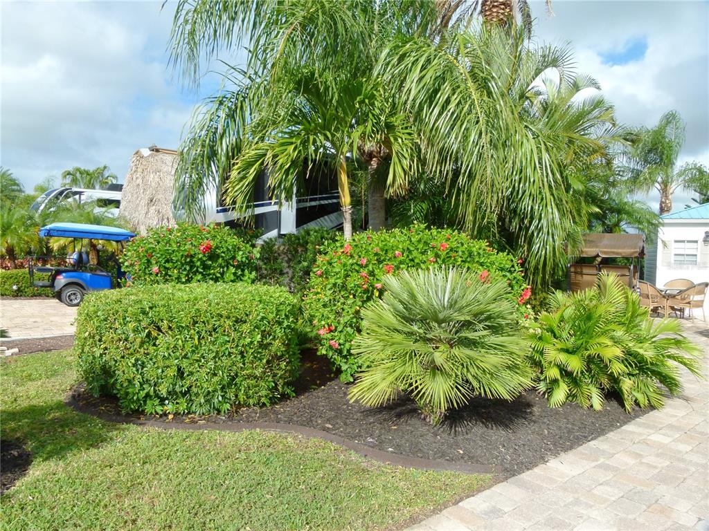 537 Southwest 40th Cove, Unit 73 Okeechobee, FL 34974 - Photo 14 of 23 a view of a garden with plants