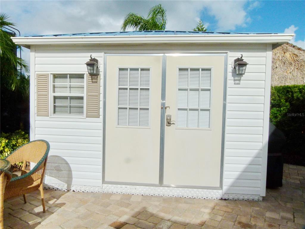537 Southwest 40th Cove, Unit 73 Okeechobee, FL 34974 - Photo 3 of 23 a front view of a house with a lounge chair