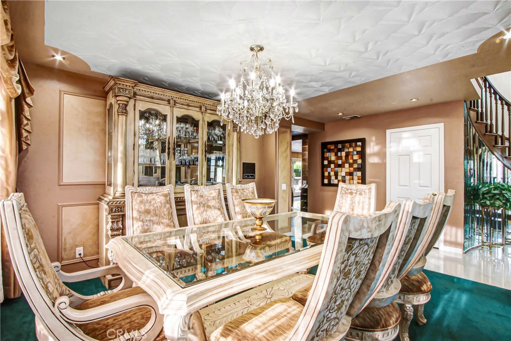 7954 Thoroughbred Street Rancho Cucamonga, CA 91701 - Photo 11 of 63 a view of a dining room with furniture and chandelier
